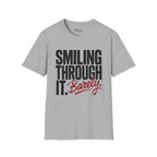 Smiling through it. Barely T-Shirt
