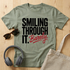 Smiling through it. Barely T-Shirt
