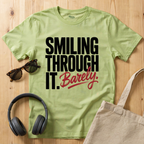 Smiling through it. Barely T-Shirt