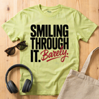 Smiling through it. Barely T-Shirt