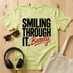 Smiling through it. Barely T-Shirt